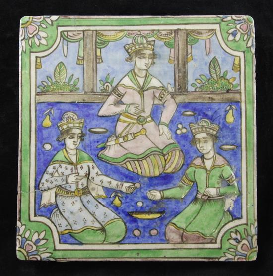 A Persian Qajar dynasty moulded polychrome pottery tile, 24cm x 24cm